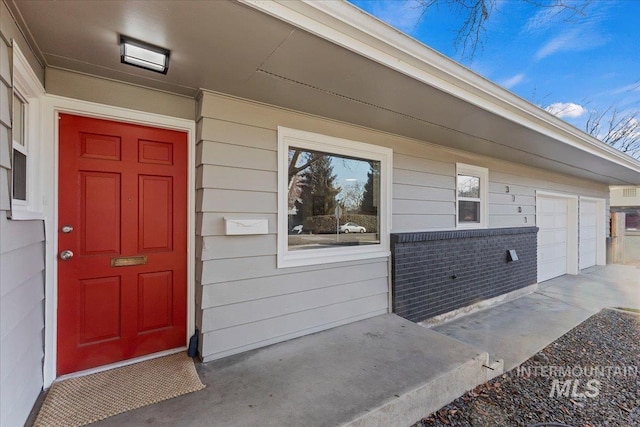 property entrance featuring a garage