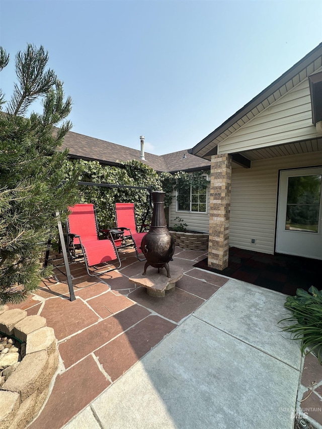 view of patio / terrace with a fire pit