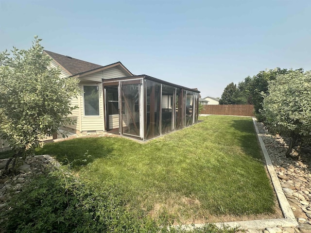 view of yard with a sunroom