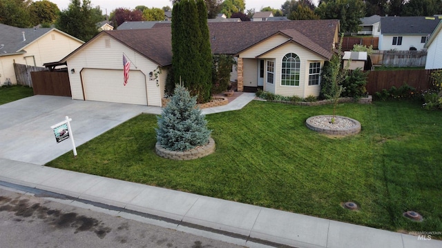 ranch-style home with a garage and a front lawn