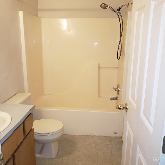 bathroom featuring vanity, toilet, and washtub / shower combination