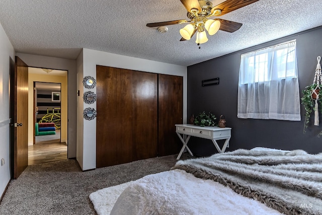 150 N 18 E, Mountain Home, ID 83647 - bedroom featuring a closet, carpet floors, a textured ceiling, and a ceiling fan