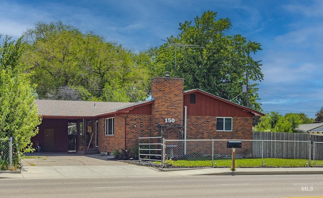 150 N 18 E, Mountain Home, ID 83647 - single story home with a chimney, brick siding, and driveway