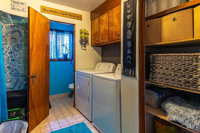 150 N 18 E, Mountain Home, ID 83647 - laundry room with light tile patterned flooring and washer and dryer