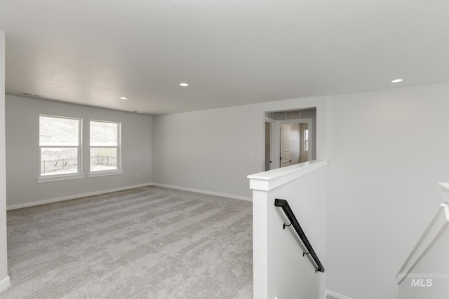 8592 N Ferris Ave, Boise, ID 83714 - unfurnished room with light colored carpet, baseboards, and recessed lighting