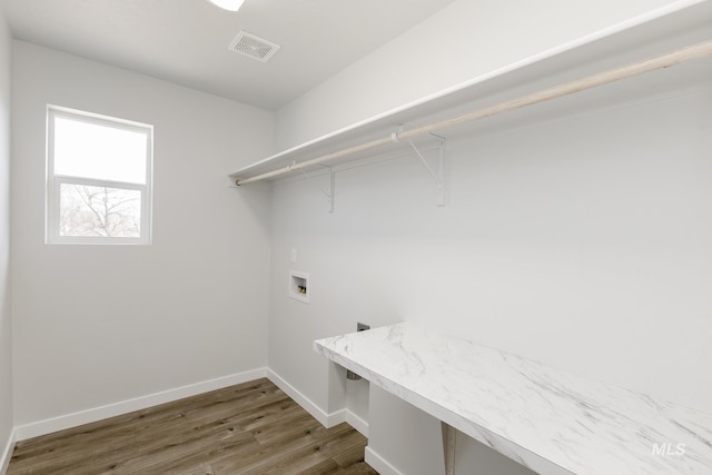 8592 N Ferris Ave, Boise, ID 83714 - laundry area with hookup for a washing machine, wood finished floors, and baseboards