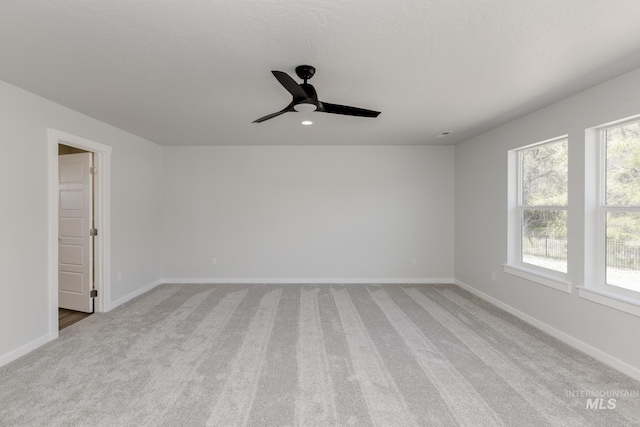 8592 N Ferris Ave, Boise, ID 83714 - spare room featuring light colored carpet, a ceiling fan, baseboards, and recessed lighting