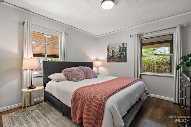 920 W Fort St, Boise, ID 83702 - bedroom featuring wood finished floors, a textured ceiling, and baseboards