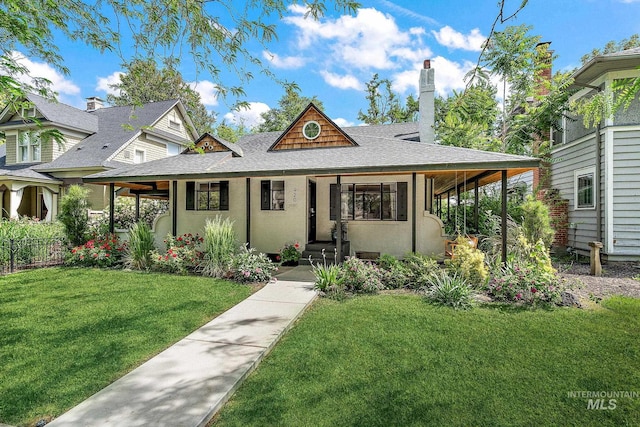920 W Fort St, Boise, ID 83702 - view of front of home with a shingled roof, a front lawn, and stucco siding
