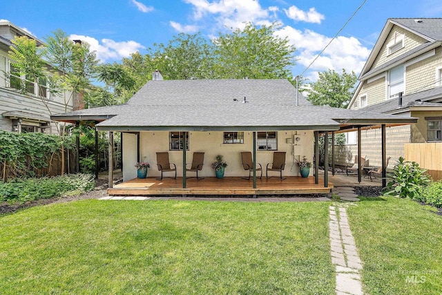 920 W Fort St, Boise, ID 83702 - rear view of property featuring stucco siding, a shingled roof, a wooden deck, and a chimney