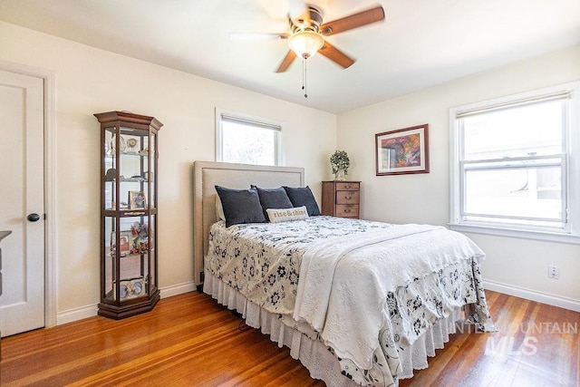 702 S Opal St, Boise, ID 83705 - bedroom with wood finished floors, baseboards, and ceiling fan