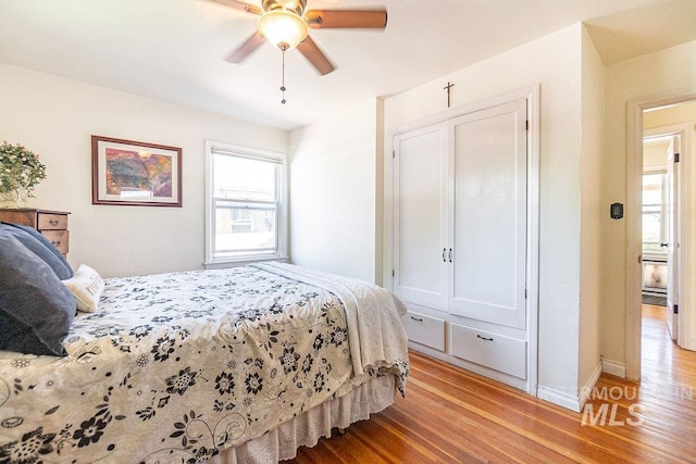 702 S Opal St, Boise, ID 83705 - bedroom featuring light wood-style floors, a ceiling fan, and baseboards