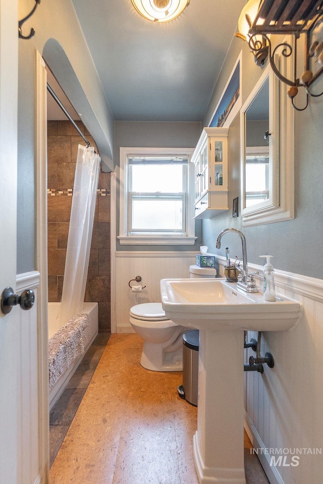 702 S Opal St, Boise, ID 83705 - full bathroom with toilet, wainscoting, and shower / bath combo with shower curtain
