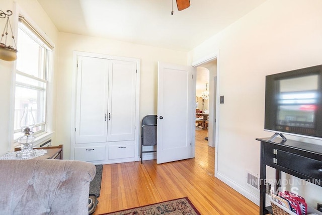 702 S Opal St, Boise, ID 83705 - living area featuring light wood-style floors, healthy amount of natural light, baseboards, and ceiling fan