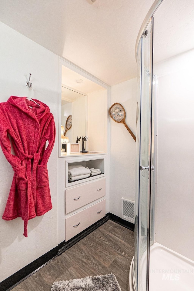 702 S Opal St, Boise, ID 83705 - bathroom with wood finished floors, a shower stall, vanity, and baseboards
