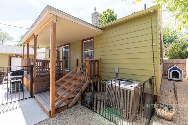 702 S Opal St, Boise, ID 83705 - back of house with a chimney and central air condition unit