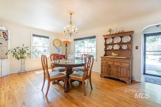 702 S Opal St, Boise, ID 83705 - dining area featuring light wood-style flooring, a chandelier, and baseboards