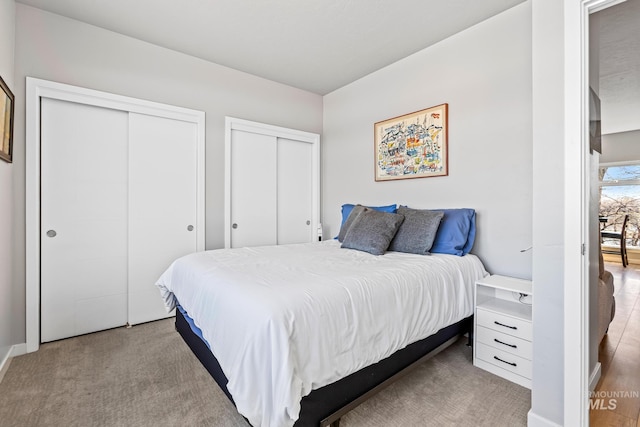 3480 N Prospect Ln, Garden City, ID 83714 - bedroom featuring carpet and multiple closets
