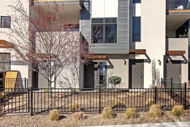 3480 N Prospect Ln, Garden City, ID 83714 - view of front of house featuring stucco siding and fence