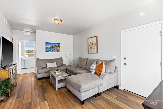 3480 N Prospect Ln, Garden City, ID 83714 - living room featuring wood finished floors and visible vents