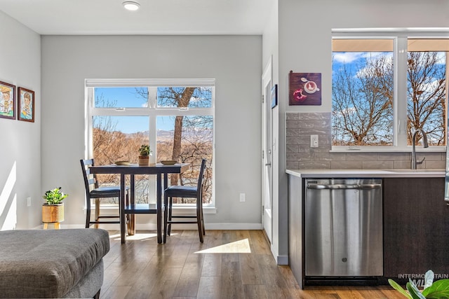 3480 N Prospect Ln, Garden City, ID 83714 - interior space featuring baseboards, a sink, and dark wood-style flooring