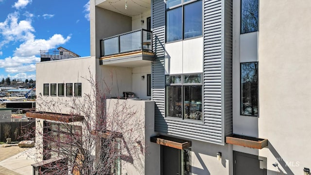 3480 N Prospect Ln, Garden City, ID 83714 - view of home's exterior featuring a balcony and stucco siding