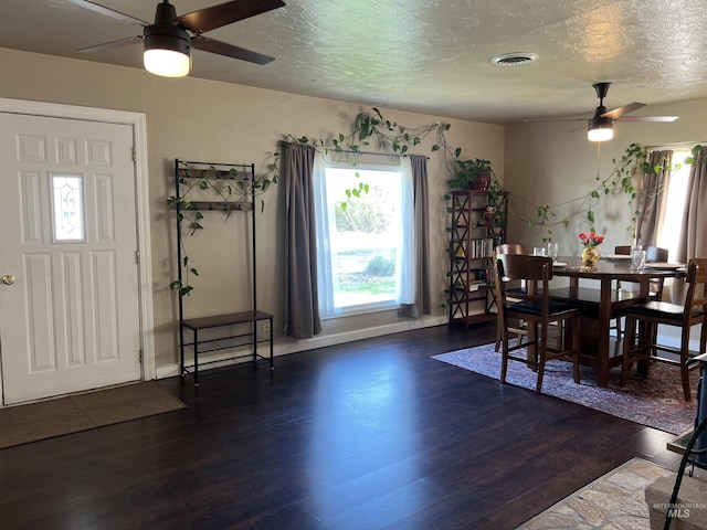 140 3rd St, Grand View, ID 83624 - dining space with visible vents, a ceiling fan, plenty of natural light, and wood finished floors
