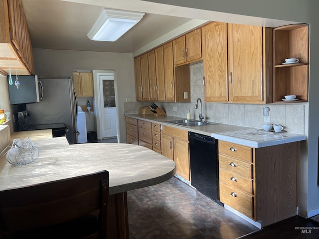 140 3rd St, Grand View, ID 83624 - kitchen with stainless steel microwave, light countertops, open shelves, black dishwasher, and a sink
