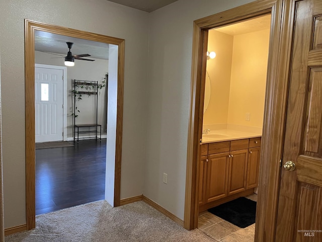 140 3rd St, Grand View, ID 83624 - hallway with a sink, baseboards, and carpet