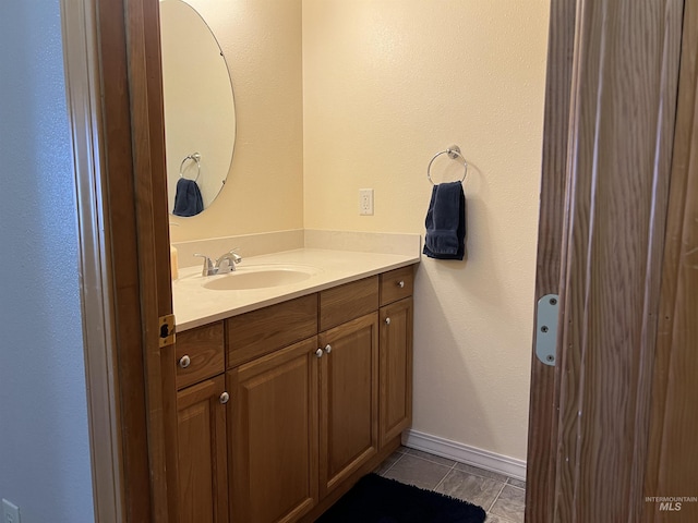 140 3rd St, Grand View, ID 83624 - bathroom featuring tile patterned flooring and vanity