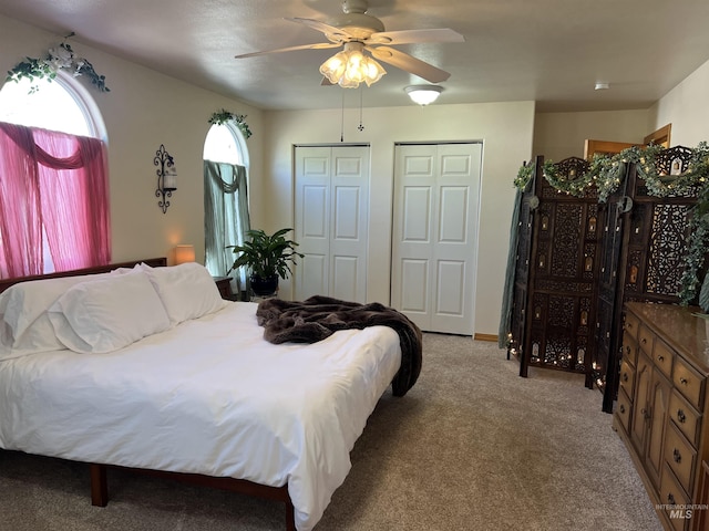 140 3rd St, Grand View, ID 83624 - bedroom featuring multiple closets, a ceiling fan, and carpet floors