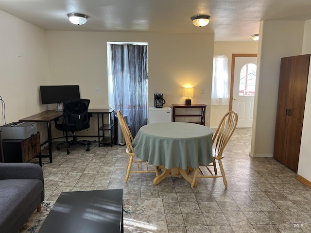 140 3rd St, Grand View, ID 83624 - dining area with stone finish floor and baseboards