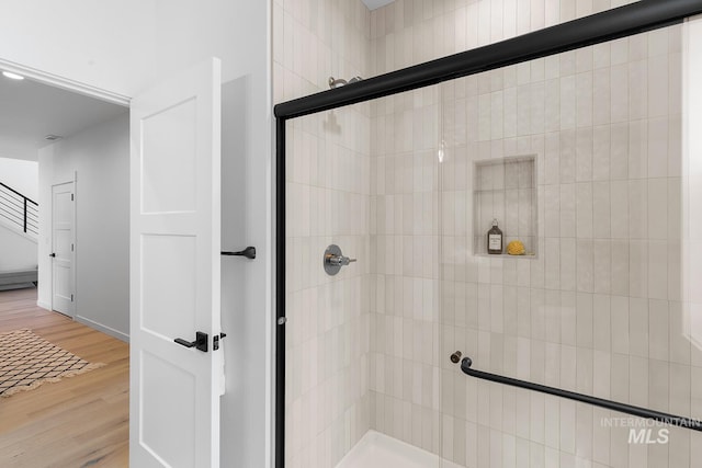 2365 E Valensole St, Meridian, ID 83642 - bathroom with a tile shower and wood finished floors