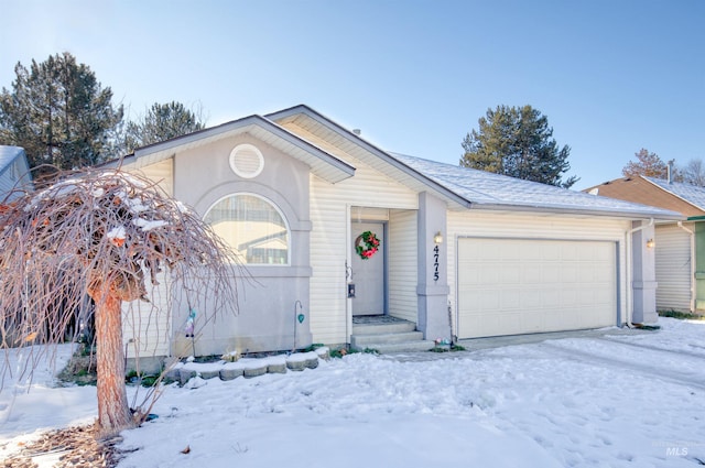 single story home with an attached garage