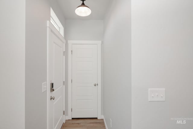 corridor featuring light hardwood / wood-style floors