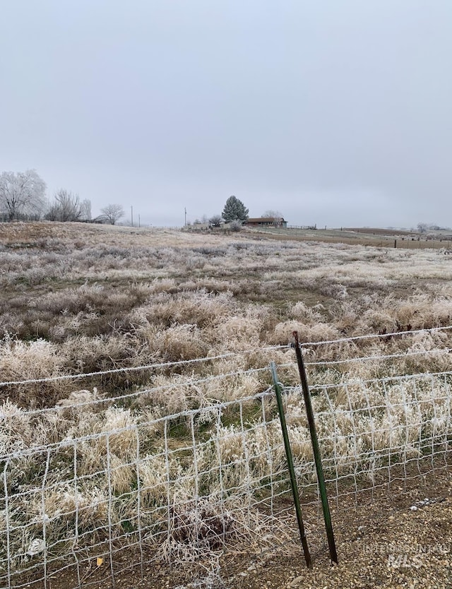 view of yard with a rural view