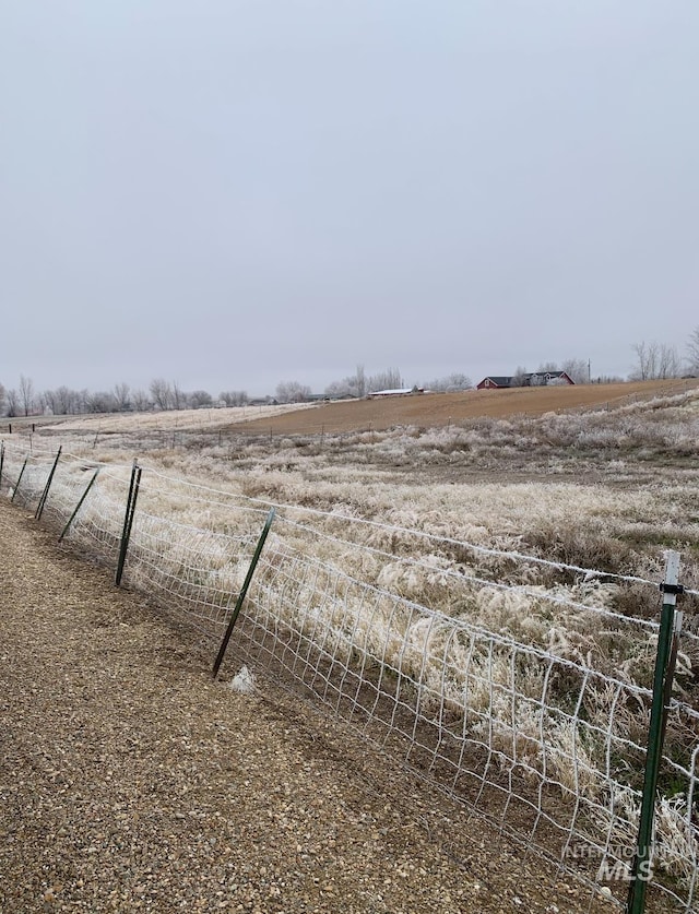view of yard with a rural view