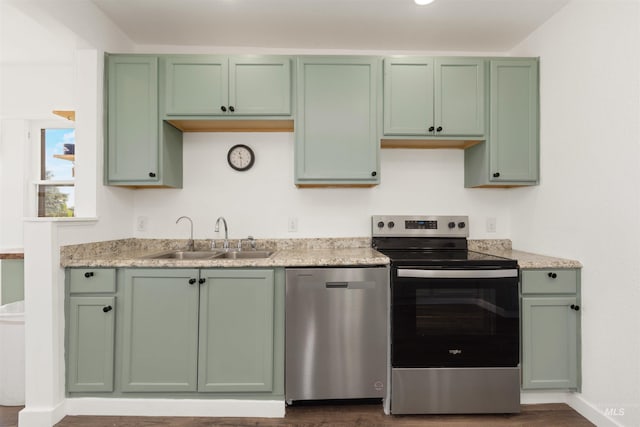 24722 Red Top Rd, Wilder, ID 83676 - kitchen with appliances with stainless steel finishes, green cabinetry, and dark wood-type flooring