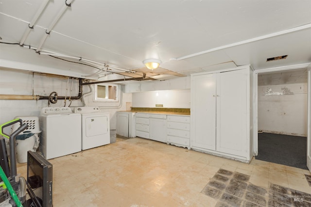 24722 Red Top Rd, Wilder, ID 83676 - below grade area featuring separate washer and dryer and light floors