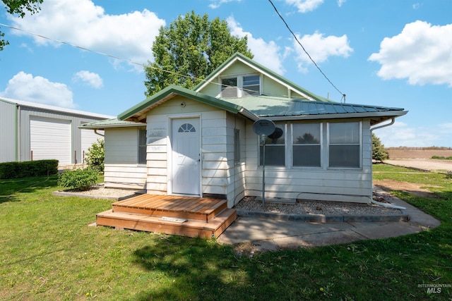 24722 Red Top Rd, Wilder, ID 83676 - view of front of house featuring a metal roof and a front lawn