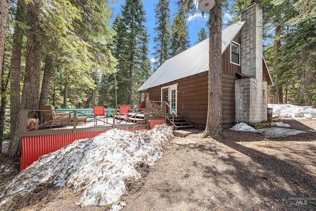 995 Cedar Crest Dr, Mccall, ID 83638 - exterior space featuring a chimney and a wooden deck