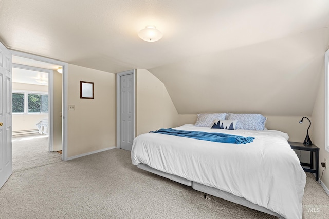 995 Cedar Crest Dr, Mccall, ID 83638 - bedroom with lofted ceiling, light carpet, and baseboards