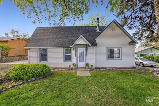 240 W Valley Rd, Hagerman, ID 83332 - view of front of house with a front yard and roof with shingles