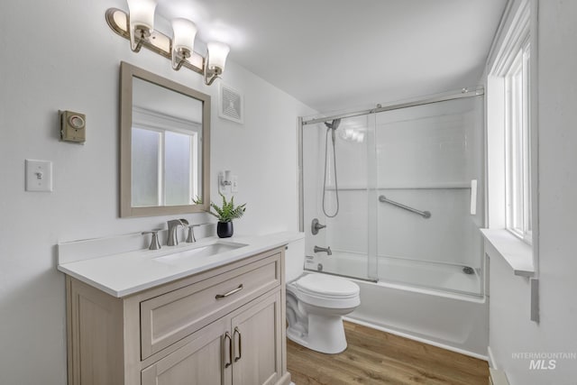 240 W Valley Rd, Hagerman, ID 83332 - bathroom with wood finished floors, vanity, toilet, and plenty of natural light