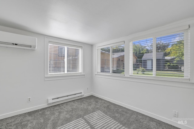 240 W Valley Rd, Hagerman, ID 83332 - spare room featuring a baseboard radiator, a wall unit AC, dark carpet, and baseboards