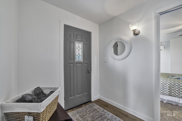 240 W Valley Rd, Hagerman, ID 83332 - entryway with dark wood-style flooring and baseboards