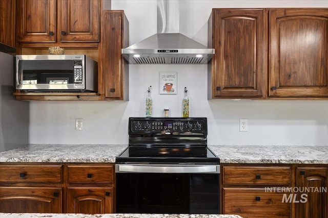 1010 N Hidden Pine Rd, Pine, ID 83647 - kitchen featuring black electric range, wall chimney range hood, stainless steel microwave, and light stone countertops
