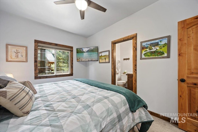 1010 N Hidden Pine Rd, Pine, ID 83647 - bedroom featuring light colored carpet, lofted ceiling, connected bathroom, a ceiling fan, and baseboards
