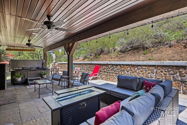 1010 N Hidden Pine Rd, Pine, ID 83647 - view of patio with a hot tub, an outdoor living space with a fire pit, and ceiling fan