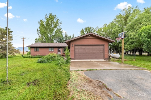 4 N 100 W, Fairfield, ID 83327 - single story home featuring a front lawn, a garage, and asphalt driveway